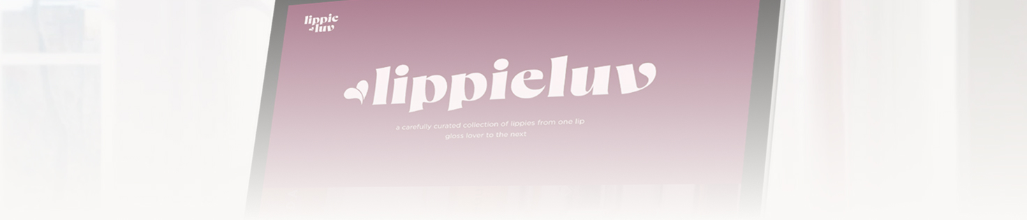 desktop monitor displaying lippiluv website design with a white overlay